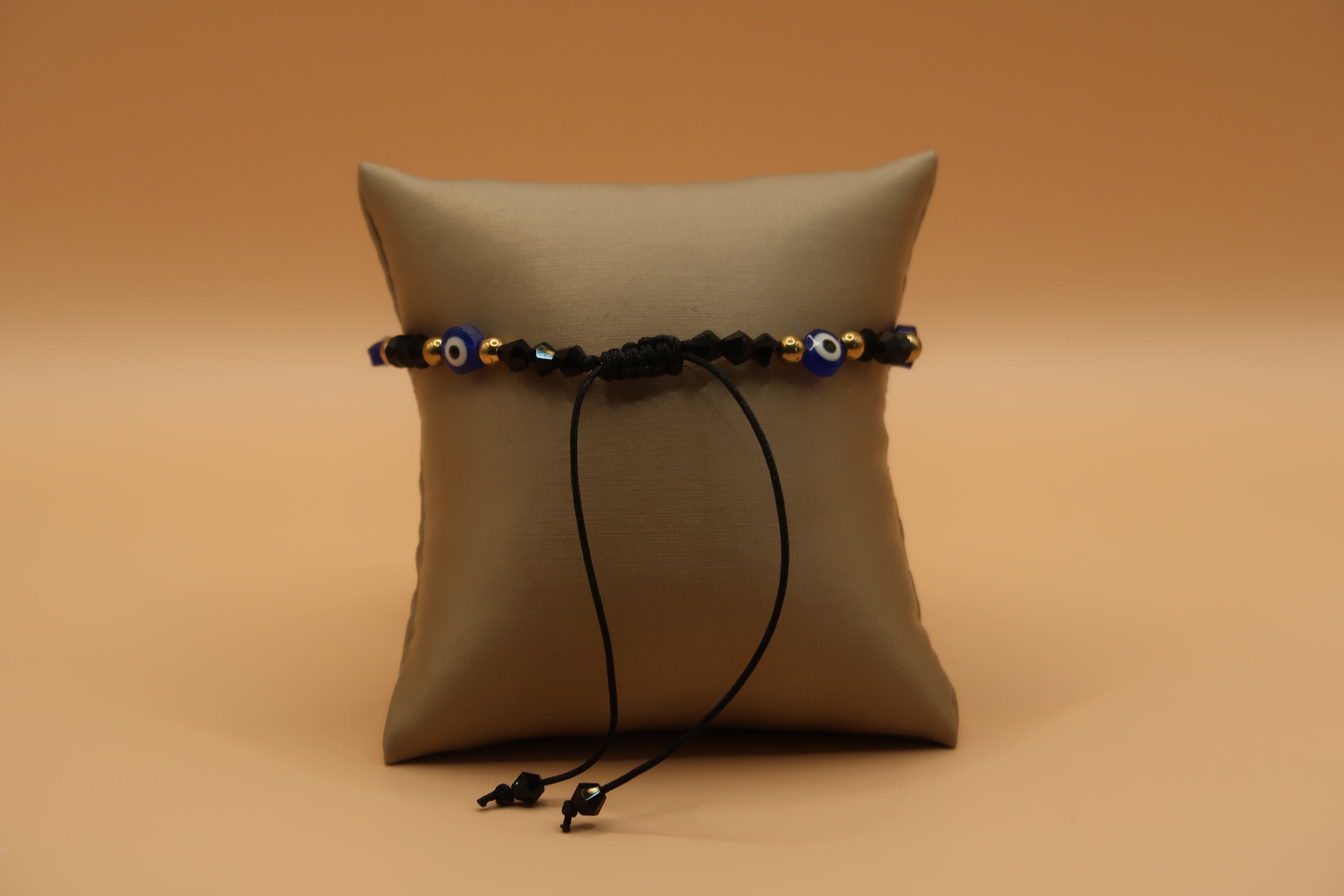 Dangling Virgin de Guadalupe black & Gold With Evil Eye Bracelet