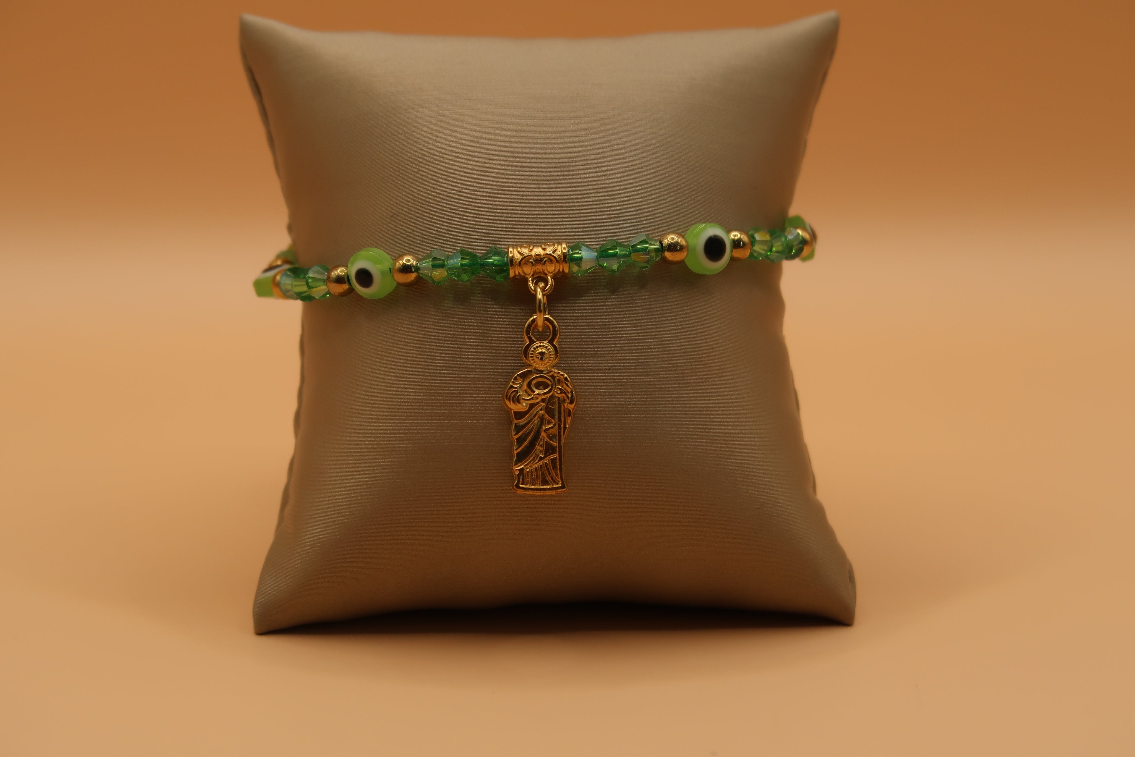 Dangling San Judas lime green evil eye bracelet