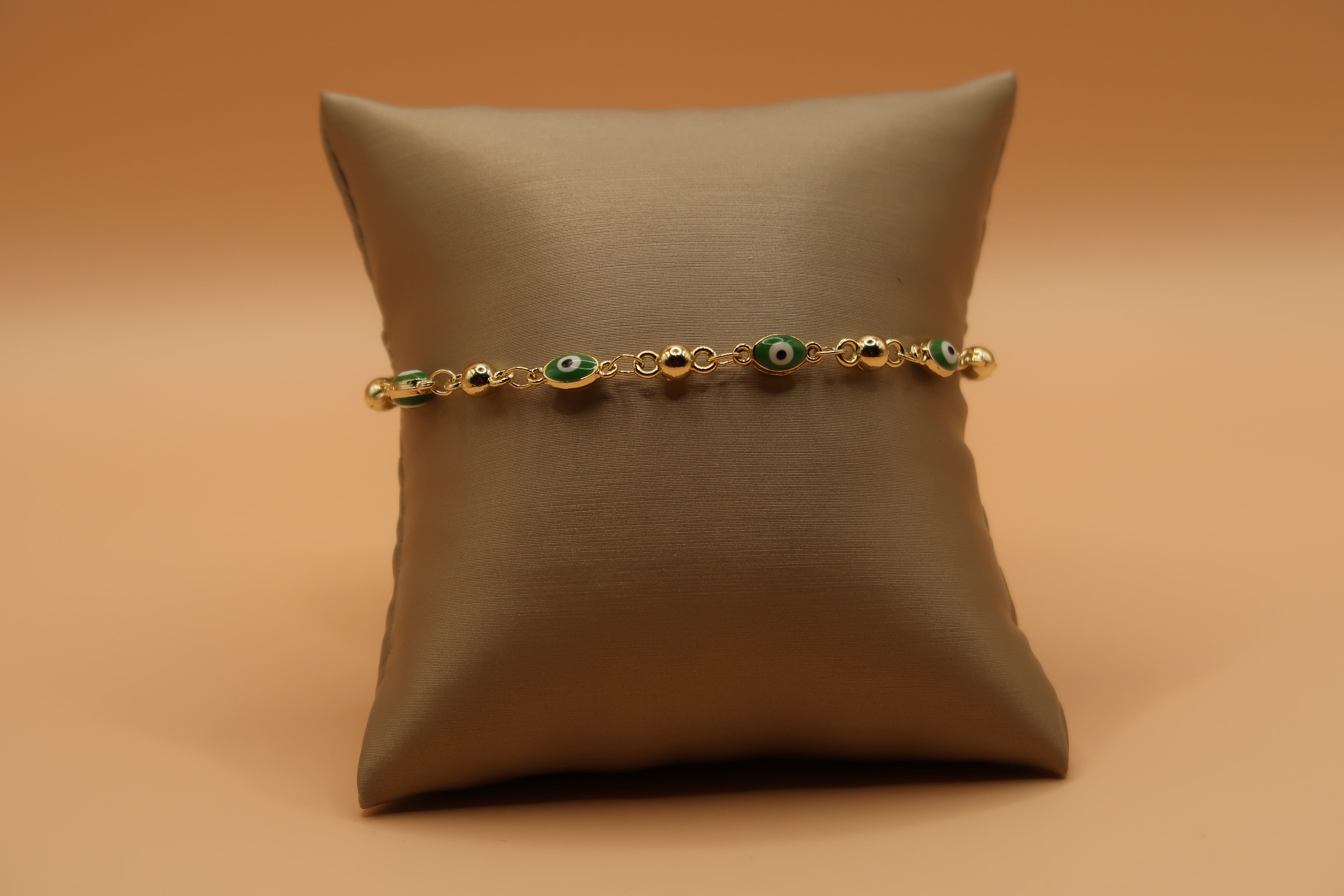 Oval green evil eye